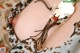 A close up of a woman wearing a necklace.